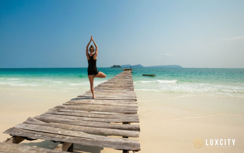 Beachside yoga sessions are part of the experience on Koh Rong